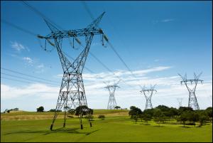 Four transmission lines in a field, ground perspective