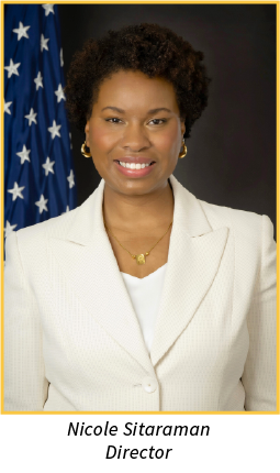 Image of woman smiling with an Amercian flag in the background